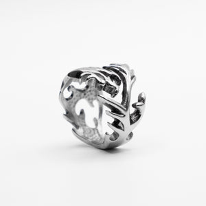 Bottom view of The Tormented Dragon Ring in Stainless Steel, revealing a unique perspective on its intricate design and craftsmanship. 