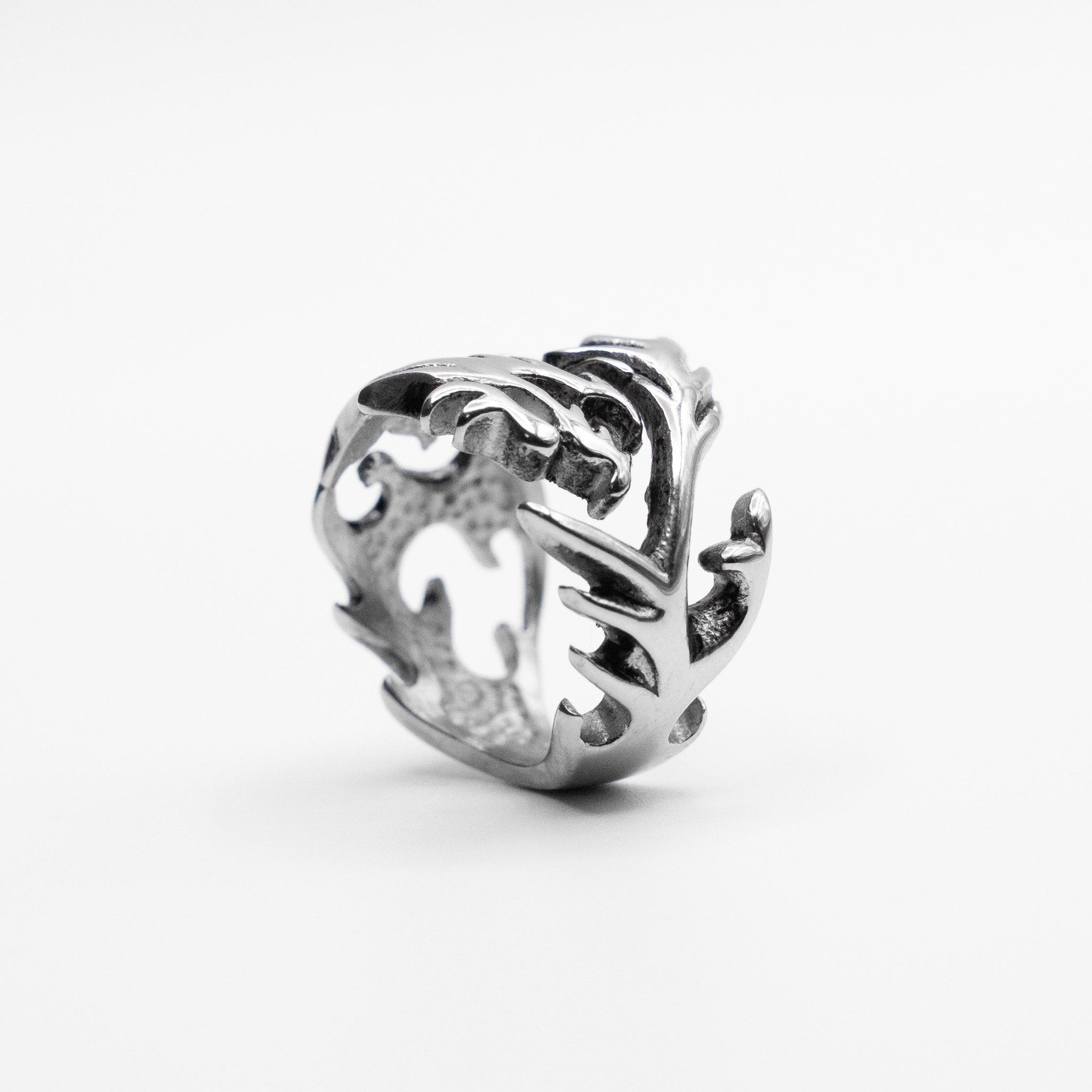 Bottom view of The Tormented Dragon Ring in Stainless Steel, revealing a unique perspective on its intricate design and craftsmanship. 